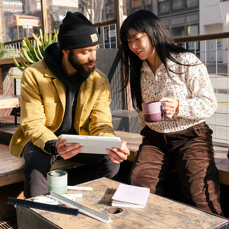 12oz-rise-mug-k0 12oz_rise_coffee_mug_dusty_orchid_couple_city_patio_square.jpg