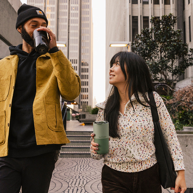 16oz-rise-tumbler-b1 16oz_rise_tumbler_black_iceberg_couple_drink_city_street_square.jpg