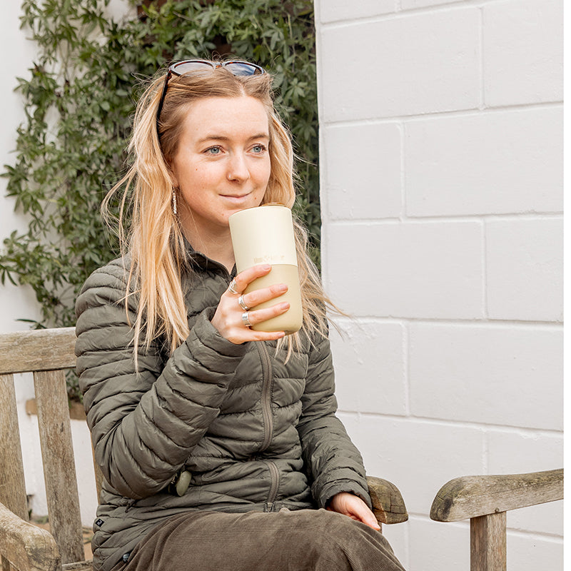 16oz-rise-tumbler-b1 16oz_rise_tumbler_wax_yellow_woman_seat_outside_square.jpg